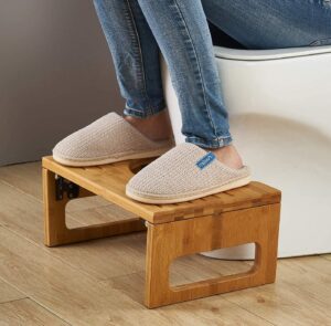 A stool under feet at the toilet